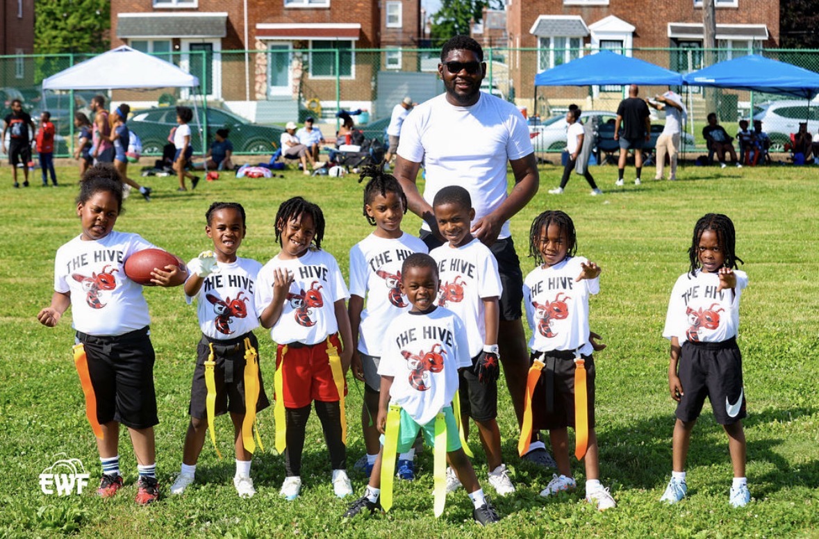 The Hive flag football team with coach