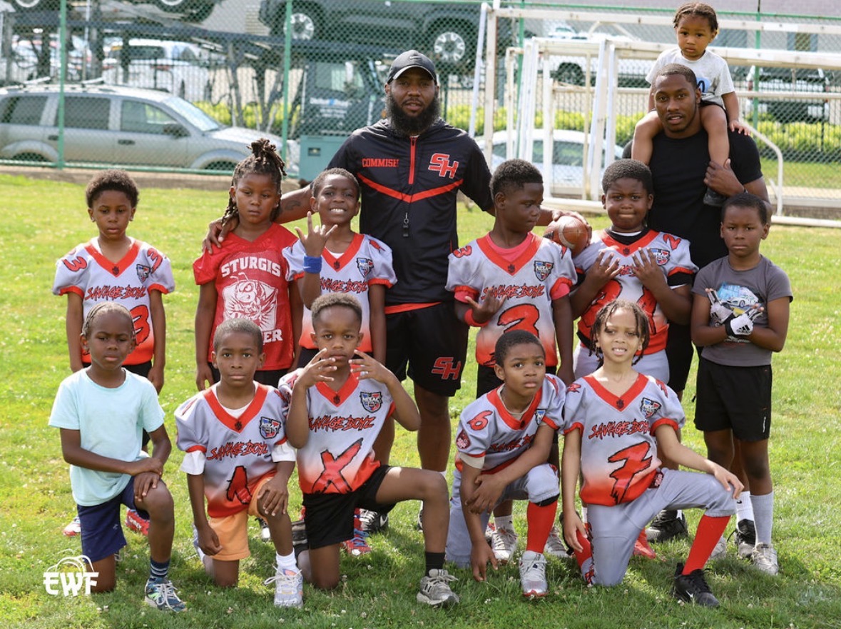 Savage Boyz team photo with coaches