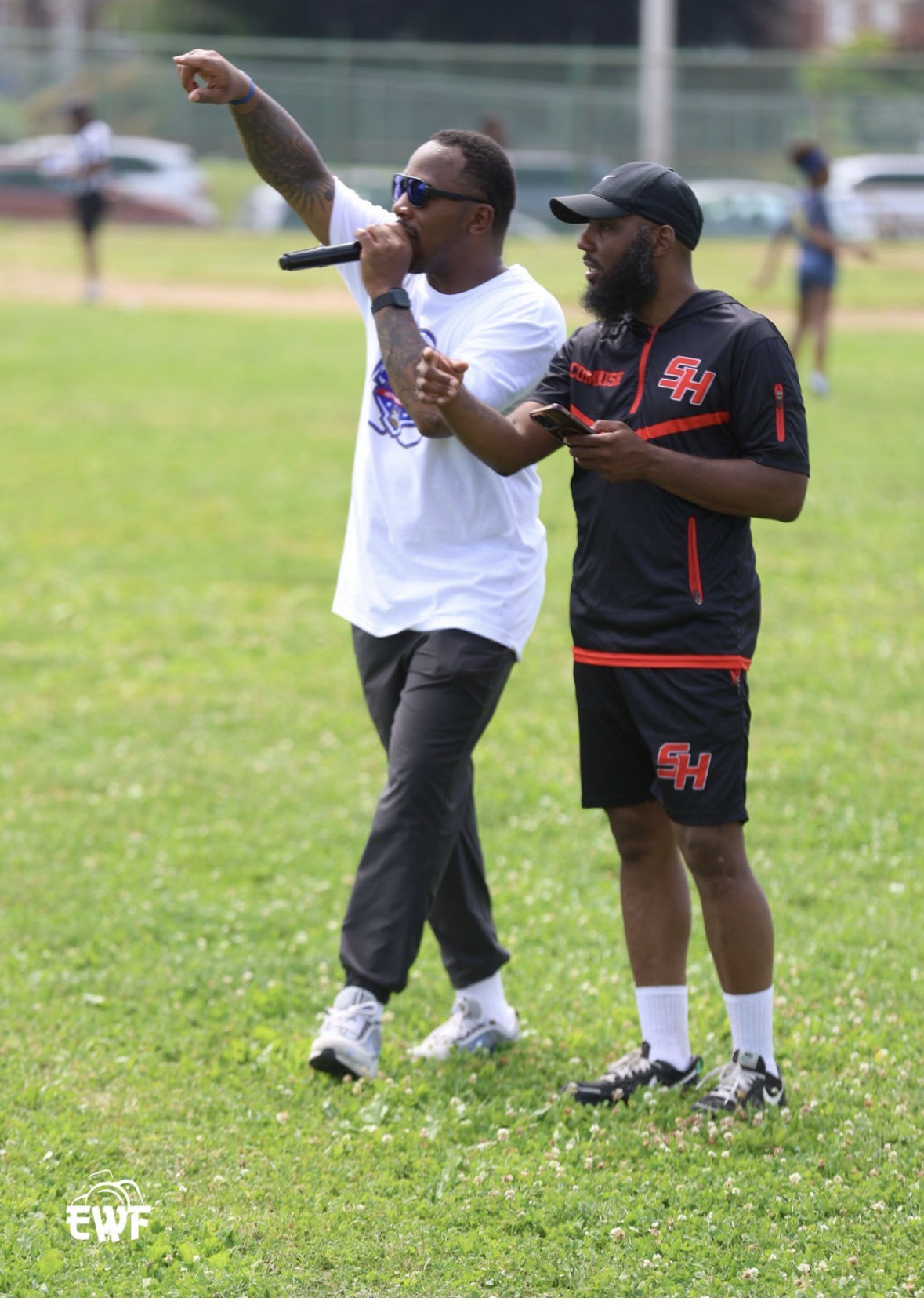 Coaches speaking at the Pull Flags Not Guns event